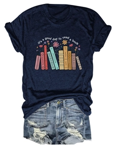 Detailed flat lay of navy t-shirt with book floral print and distressed denim shorts