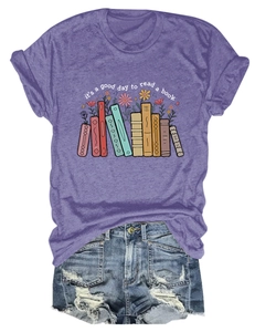 Flat lay of purple cotton T-shirt with book floral print and distressed denim shorts