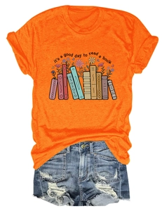 Detailed flat lay of casual orange t-shirt with book floral print and denim shorts