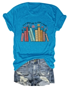 Detail showing high-quality cotton t-shirt with books and flower print and blue color