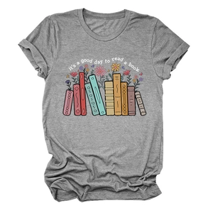 Detailed view of heather grey knit fabric with books and floral graphic print