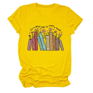 Close-up of vibrant yellow cotton tee featuring a colorful book and floral graphic print