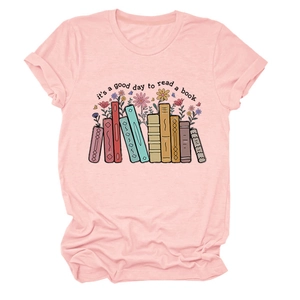 Detail of pink cotton T-shirt featuring colorful books and floral graphic print design