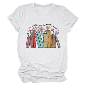 Detailed view of colorful book and floral print on a white cotton crewneck t-shirt