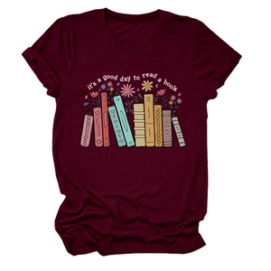Detail of burgundy t-shirt featuring floral book spine print and reading quote