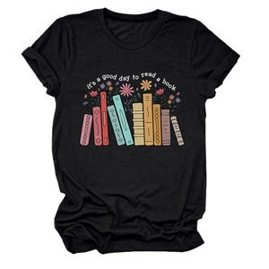Detail of printed text 'it's a good day to read' and colorful book graphics on a black T-shirt