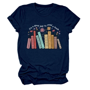 Detailed flat lay of navy blue T-shirt featuring artistic book illustration and floral quote