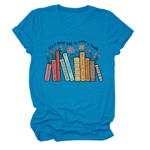 Close-up of vibrant blue cotton T-shirt featuring a colorful book and floral graphic print