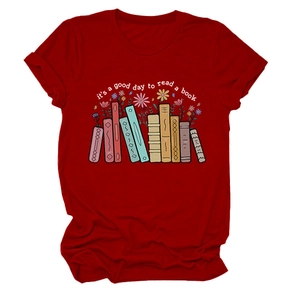 Detailed view of the colorful book and flower graphic print on this red cotton t-shirt