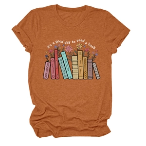 Detail of artistic book floral print on burnt orange cotton t-shirt with slogan