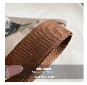 Close-up of the durable brown woven thickened shoulder strap with clear twill texture