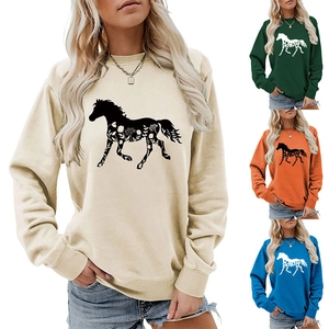 Close-up of crewneck sweatshirt featuring a floral horse silhouette graphic print