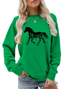 Close-up of green long-sleeved sweatshirt featuring a black horse and floral print detail