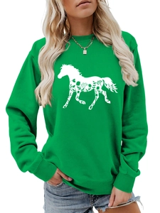 Detail view of grass green long sleeve sweatshirt featuring white floral horse silhouette