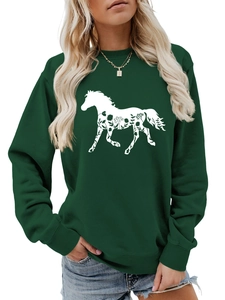 Detail showing high-quality horse floral print and ribbed cuffs on dark green sweatshirt