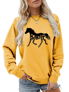 Detail of yellow round neck sweatshirt featuring a horse silhouette with floral patterns