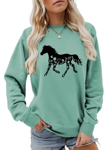 Detail of floral horse silhouette print on mint green long sleeve sweatshirt
