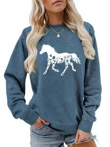 Detail of fog blue sweatshirt with white horse silhouette and floral print pattern