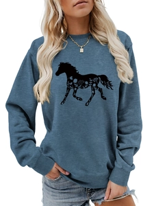 Detail of horse silhouette with floral patterns on blue round neck sweatshirt