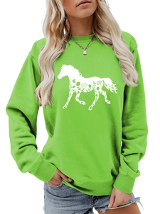 Detail of floral horse print on neon green crewneck sweatshirt with ribbed cuffs