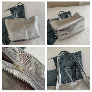 Detail shots of silver crocodile pattern tote bag with gold zipper and textured surface