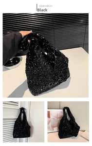 Detail view of shimmering black sequin tote bag showing sparkling texture and material