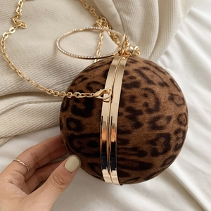 Detail of leopard print ball evening bag with crystal handle and gold chain strap