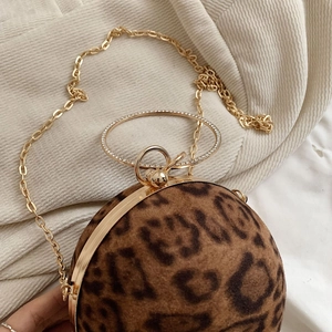 Detail of leopard print ball evening bag with gold chain and crystal ring handle