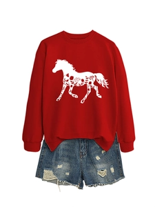 Close-up of red crewneck sweatshirt with horse floral print and distressed denim shorts