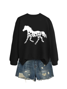 Detail of black crewneck sweatshirt with horse floral print and distressed denim shorts