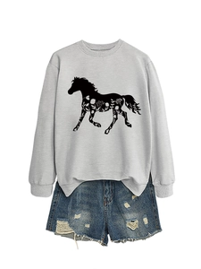 Detail of light gray sweatshirt featuring a black horse silhouette with floral patterns