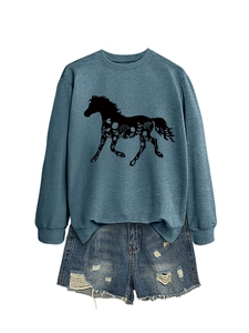 Detail of blue long-sleeve sweatshirt featuring horse silhouette and floral print