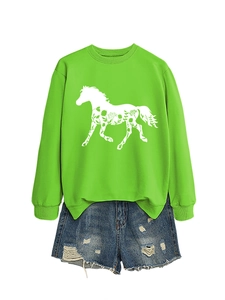 Close-up of vibrant lime green sweatshirt featuring a white floral horse graphic print