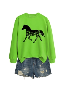 Detail of green long sleeve sweatshirt with horse floral print and denim shorts