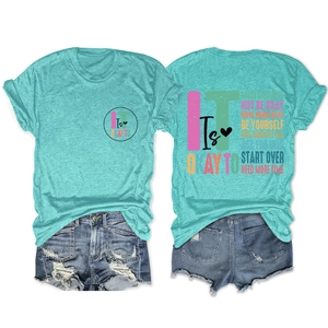 Rear view of turquoise t-shirt with colorful inspirational typography and denim shorts