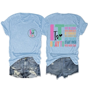 Close-up of light blue cotton T-shirt featuring inspirational quote back print and denim shorts