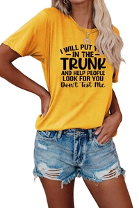 Detail of soft yellow crewneck t-shirt with black printed slogan and denim shorts