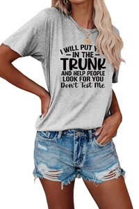 Detail of grey crew neck t-shirt with slogan and distressed denim shorts set