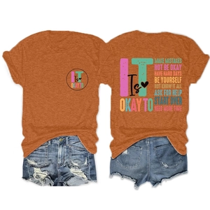Detail view of the colorful inspirational slogan prints on front and back of the cotton t-shirt