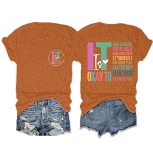 Detailed back view of burnt orange T-shirt with colorful inspirational typography