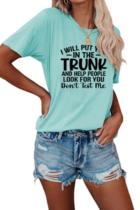 Detail of light blue crew neck t-shirt with black graphic text print and denim shorts
