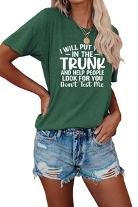 Detail of dark green t-shirt with funny white slogan print and distressed denim shorts