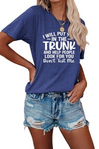Detail of navy blue crew neck T-shirt with white slogan print and ripped denim shorts