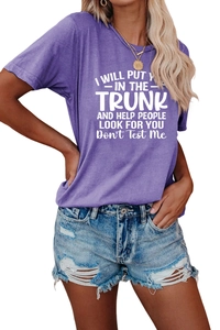 Detail of purple cotton T-shirt with white slogan and distressed denim shorts with holes