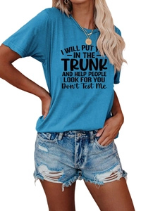 Detail of light blue crew neck t-shirt with slogan and distressed denim shorts