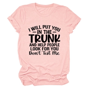 Detail of light pink T-shirt featuring funny black quote print with a smooth texture