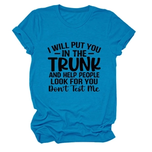 Detail of a bright blue cotton T-shirt featuring a black graphic slogan and rolled sleeves