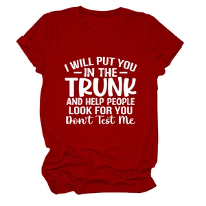 Detail of red crew neck T-shirt featuring white artistic slogan print on front
