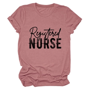 Close-up of black Registered NURSE typography on a dusty rose cotton short sleeve T-shirt