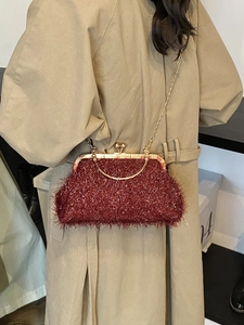 Elegant burgundy sequin evening bag with gold chain strap and vintage tassel design